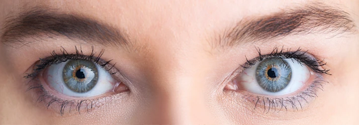 A close-up photo of a woman's eyes with clear vision